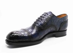 Style: 5817-1233A-Navy Exclusively for C & E, this Completely Handmade, Hand Burnished Genuine Alligator lace-up oxford from the Ugo Vasare collection features Goodyear Welted construction, soft Calfskin lining, a Cap Toe, Decorative Perforations with Pinking Detail, a stitched welt and a full Leather sole! Please note: Some sizes are on Back Order. Elegant Formal Oxfords With Crocodile Pattern, Elegant Blue Lace-up Oxfords, Formal Fitted Oxfords With Crocodile Pattern, Navy Elegant Oxfords For Business, Elegant Navy Oxfords With Round Toe, Luxury Fitted Oxfords For Galas, Elegant Navy Oxfords For Business, Luxury Crocodile Pattern Oxfords For Semi-formal Events, Luxury Crocodile Pattern Oxfords For Semi-formal Occasions