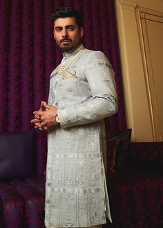 Sky Blue Sherwani Dress for Pakistani Groom Dresses Blue Raw Silk Sherwani, Transitional Blue Raw Silk Sherwani, Blue Sherwani For Traditional Ceremonies With Traditional Drape, Fitted Long Kurta For Traditional Ceremonies, Blue Naqshi Sherwani For Wedding, Blue Sherwani With Naqshi And Traditional Drape, Blue Sherwani With Naqshi In Traditional Drape, Elegant Nehru Jacket For Diwali Ceremonies, Fitted Blue Sherwani For Traditional Ceremonies