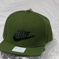 This Is A Brand New Nike Snap Back Cap Olive Green. Nike Baseball Cap, One Size Fits Most, Nike Baseball Cap Snapback, Nike Adjustable Snapback Baseball Cap, Nike Cap For Streetwear, Trendy Green Flat Bill Hats, Nike Adjustable Snapback Hat, Nike Adjustable Snapback Hat With Curved Brim, Nike Casual Baseball Cap, Nike Casual Fitted Baseball Cap