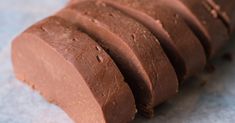 slices of chocolate cake sitting on top of a table