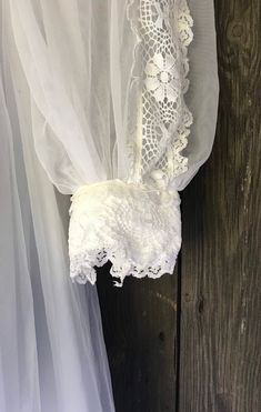 "Lovely nylon 70s wedding dress. Fully lined with lace trim and high neck. Very good clean condition. Empire cut. Chest 16\" Pit to waist 4.5\" High waist 14\" Pit to hem 43\"" White Lace Trim Vintage Dress For Events, Vintage White Wedding Dress With Lace Trim, Bohemian Victorian Dress With Lace Trim For Wedding, Spring Wedding Victorian Dress With Lace Patchwork, Bohemian Vintage Wedding Dress With Lace Trim, Bohemian Victorian Wedding Dress With Lace Trim, White Victorian Wedding Dress With Lace Trim, Vintage White Victorian Dress With Lace Trim For Wedding, Vintage White Victorian Wedding Dress With Lace Trim