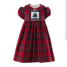 New With Tag Treat Your Little One To The Cutest Christmas Look With This Irresistible Tartan Dress! Featuring Cheery Hues Of Red And Green, Puff Sleeves, A Darling Collar, Frill Trims, And A Hand-Smocked Christmas Tree On The Bodice, This Holiday Outfit Is Oh-So-Special. Fully Lined With A Button Closure And Sash To Tie At The Back, This Festive Ensemble Will Bring Extra Joy! Shell: 80% Polyester, 17% Viscose, 3% Elastane. Lining: 100% Cotton Machine Wash With Similar Colours. Medium Steam Iron Tartan Plaid Christmas Tree, Smocked Christmas Dresses, Tartan Plaid Christmas, Festive Dress, Christmas Tree Dress, Rachel Riley, Tree Dress, Green Tartan, Hand Smock