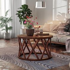 a living room with a couch, table and potted plants on the coffee table