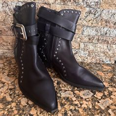 Free People Billy Western Pointed Toe Studded Boots In Black New Without Box They Have Been Bought From An Outlet Store So They Might've Been Store Handled. Size Eu 39.5/ Us 9.5 Silvertone Studs Punctuate The Leather Upper Of This Pointy-Toe Boot With A Buckle Double Wrapping The Shaft. Details - 1.5" Heel. 6.25" Shaft. Questions? Leave A Comment Below! Designer Heeled Boots With Buckle Closure For Fall, Designer Heeled Boots With Buckle For Fall, Studded Leather Boots With Pointed Toe, Pointed Toe Boots With Buckle Closure, Chic Black Moto Boots With Snip Toe, Studded Leather Moto Boots With Pointed Toe, Studded High Heel Boots For Fall, Designer Ankle Moto Boots For Fall, Black Boots With Buckle Closure And Pointed Toe