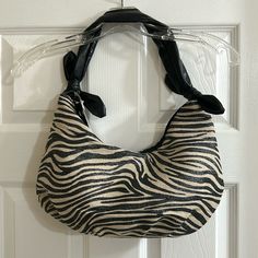 This Darling Nwt Hobo Style Handbag Has A Linen Print In Black And Tan, With A Slight Metallic Fleck In It. It Has A Zipper Top And Three Pockets On The Inside. Thank You For Visiting My Closet. Chic Zebra Print Shoulder Bag For Everyday Use, Chic Black Bag With Zebra Print, Chic Black Bags With Zebra Print, Chic Rectangular Shoulder Bag With Zebra Print, Everyday Use Zebra Print Shoulder Bag, Brown Rectangular Hobo Bag With Silver-tone Hardware, Brown Hobo Bag With Silver-tone Hardware, Black Hobo Bag With Silver-tone Hardware, Chic Rectangular Zebra Print Shoulder Bag