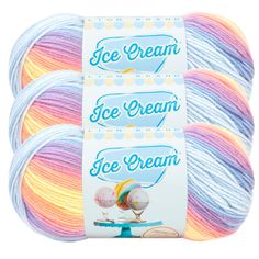 three skeins of ice cream yarn in multi - colored colors on a white background