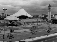 an old black and white photo of a large building