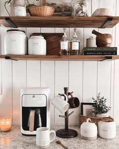 the kitchen counter is clean and ready to be used as a coffee bar or breakfast bar