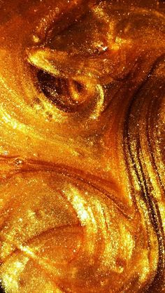 an image of some gold glitter in the air