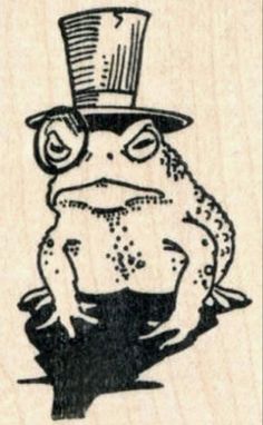 a rubber stamp with a frog wearing a top hat