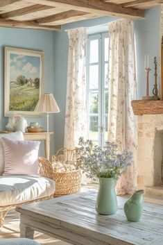 a living room filled with furniture and a fire place in front of a painting on the wall