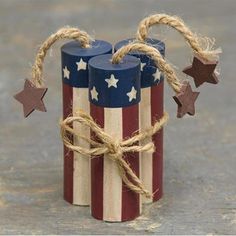 two patriotic candles tied together with twine