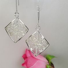 Filigree earrings meticulously crafted using the intricate filigree technique. The geometric sterling silver earrings are inspired by the elegance of Art nouveau jewelry. These long silver earrings are a perfect meaningful gift for a beloved woman, and as a pampering gift for yourself. The jewelry is very flattering, comfortable to wear as jewelry for everyday use and impressive as jewelry for a special occasion. Each piece is individually crafted to order, ensuring a unique touch, with subtle v Ornate Sterling Silver Earrings With Elegant Design, Sterling Silver Dangle Earrings With Intricate Design, Traditional Sterling Silver Earrings With Elegant Design, Delicate Nickel-free Silver Earrings, Elegant Sterling Silver Earrings, Delicate Sterling Silver Earrings In Silver, Delicate Earrings With Intricate Design For Gift, Elegant Sterling Silver Filigree Earrings, Silver Elegant Drop Earrings