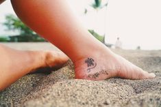 a person with a small tattoo on their foot