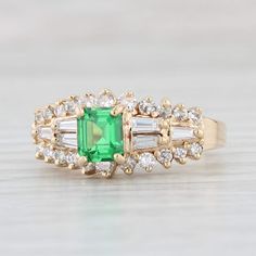 Gemstone Information: - Natural Tsavorite Garnet - Carats - 0.75ct  Cut - Emerald Color - Green - Natural Diamonds - Total Carats - 0.44ctw Cut - Round Brilliant Color - H - I Clarity - VS2 - Natural Diamonds - Total Carats - 0.26ctw Cut - Baguette Color - G -H Clarity - VS2 - SI1 Metal: 14k Yellow Gold Weight: 4.9 Grams  Stamps: 14k P (P = Plumb for high quality gold) NEI Face Height: 9.4 mm  Rise Above Finger: 8.7 mm Band / Shank Width: 2 mm This ring is a size 7, but it can be resized up 2 sizes for a $40 fee. If you would like your ring resized, please select the appropriate fee from the listing below in order to pay the sizing fee: https://www.etsy.com/listing/781388346/ring-sizing-service-fee Each piece is thoroughly examined and refinished as needed by our professional jewelers, gra Mens Custom Jewelry, Garnet And Diamond Ring, Tsavorite Garnet, Greensboro Nc, Emerald Color, Recycled Jewelry, Rise Above, Ring Pictures, Message Jewelry