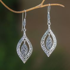 Crafted of sterling silver two baby leaves dangle within larger shapes in this pair of earrings from Bali. Wayan Asmana presents this wonderful accessory which is accentuated by a striking combination of finishes. Nickel Free Leaf-shaped Sterling Silver Jewelry, Nickel Free Sterling Silver Leaf-shaped Earrings, Nickel-free Sterling Silver Leaf-shaped Earrings, Nickel Free Leaf-shaped Sterling Silver Earrings, Hypoallergenic Sterling Silver Leaf-shaped Earrings, Sterling Silver Leaf-shaped Jewelry With Ear Wire, Nickel-free Leaf-shaped Sterling Silver Earrings, Silver Leaf-shaped Jewelry With Ear Wire, Sterling Silver Leaf-shaped Earrings