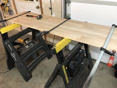 the workbench is being used to make a table sawing station for woodworking