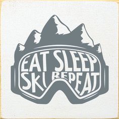 the words eat sleep ski repeat are printed on a white square coaster with mountains in the background