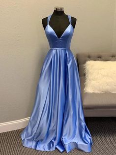 V-neck Prom Ball Gown With Fitted Bodice, A-line Gown With Sweep Train For Prom, A-line Prom Gown With Sweep Train, V-neck Homecoming Dress With Sweep Train, A-line Ball Gown With Sweep Train For Prom Season, Fitted Bodice V-neck Prom Gown, V-neck Gown With Fitted Bodice For Prom, V-neck Gown For Prom, Blue A-line Evening Dress For Wedding