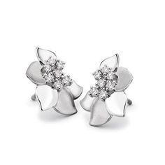 Platinum Earrings by Jewelove Platinum Earrings with petals of platinum stamen of diamonds. The petals are alternating matte finish hi-polish. Metal : Platinum Platinum Purity : 95% Purity Mark : Pt 950 Gemstone : Natural Diamonds Certificate of Authenticity : Platinum Guild International P.S. : You can select to order the Earrings Only, Pendant Only or Both from the options above. Diamond Grading Report : SGL Silver Flower Diamond Earrings For Formal Occasions, Elegant Flower Shaped White Gold Diamond Earrings, Formal White Gold Flower Earrings With Diamond Accents, Formal Silver Flower Earrings With Diamond Accents, Silver Flower Earrings With Diamond Accents For Formal Occasions, Classic Silver Flower Shaped Diamond Earrings, Platinum Chain, Platinum Earrings, Love Band