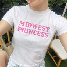 Midwest Princess Baby Tee, Women's Fitted Tee or Unisex Shirt, Aesthetic Baby Tee, Trendy Top, Y2K 90s Baby Tee, Midwest Girlie Gift DETAILS - 100% cotton (fiber content may vary for different colors) - tear-away label  SIZING Sizes vary by shirt style. Please check the size chart before making your purchase. PLEASE NOTE: Our Baby tee is sized for a youth, reminiscent of the '90s-era shrunken-down T-shirt. This style, popularized by the skater/raver culture of the time, is not to be confused wit 90s Slogan T-shirt In Pink, 90s Pink Letter Print Tops, 90s Pink Slogan Tops, 90s Style Pink Slogan Tops, Pink 90s Slogan Tops, 90s Style Pink T-shirt With Letter Print, 90s Style Pink T-shirt With Text Print, 90s Style Pink T-shirt With Slogan, 90s Slogan Pink T-shirt