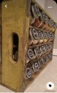 an old wooden box filled with lots of jars