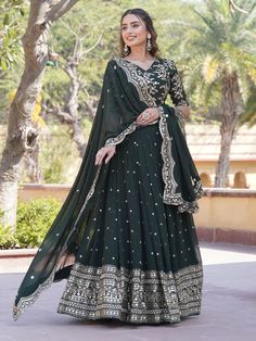 Introducing the epitome of elegance and grace, behold the dark green Georgette lehenga ensemble adorned with intricate sequin and embroidered work, perfect for your mehendi celebrations. Crafted with meticulous attention to detail, this ensemble exudes sophistication and charm, promising to make you the cynosure of all eyes on your special day.
The dark green Georgette lehenga boasts a mesmerizing 3.5-meter flair, ensuring graceful movements with every step you take. Its exquisite sequin and emb Engagement Gown, Lehenga Crop Top, Georgette Lehenga, Lehenga Choli Wedding, Floral Lehenga, Party Wear Lehenga Choli, Reception Gown, Bollywood Lehenga, Cocktail Wear