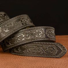 Embody the power of luxury with our unique belt, adorned with a buckle shaped like three crocodiles. Inspired by ancient legends, this discreet accessory allows you to make a subtle yet impactful statement. Its finely crafted buckle evokes strength and power, adding a touch of character to any outfit. A peerless style statement. Luxury Embroidered Brown Belts, Luxury Adjustable Embroidered Belt, Formal Adjustable Engraved Belt, Luxury Belts With Antique Buckle, Luxury Black Embroidered Belt, Elegant Black Belt With Antique Buckle, Luxury Adjustable Belt With Buckle, Luxury Adjustable Silver Belt Buckles, Formal Black Embroidered Belt