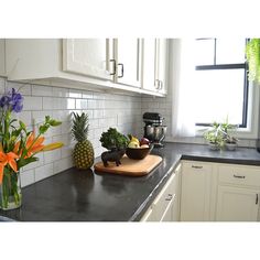 the kitchen counter is clean and ready to be used as a cutting board for fruit