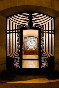 Art Deco door; entrance of a building in Paris by  Léon Tissie; ironwork by Adalbert Szabo; photo by Claude Abron