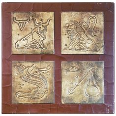 four metal plaques with designs on them in different shapes and sizes, all depicting the zodiac signs