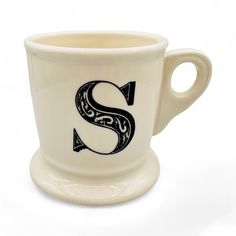 a coffee cup with the letter s on it