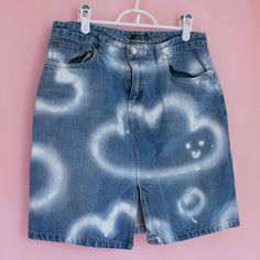 Denim skirt upcycled with textile spray paint. Cute smiling clouds design. Part of my very first collection of upcycled clothing presented at the 2023 M.A.D. festival.  Medium size for women Spray Painted Jeans, Spray Paint Clothes, Spray Paint Jeans, Painted Denim Skirt, Jeans Painting, Painted Skirt, Upcycling Jeans, Jeans Art, Waves Art