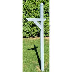 a cross is standing in the grass