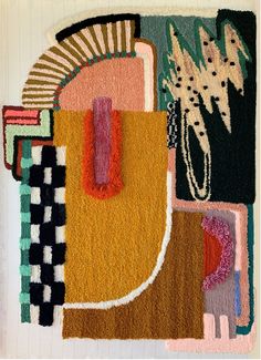 an abstract rug with various colors and shapes