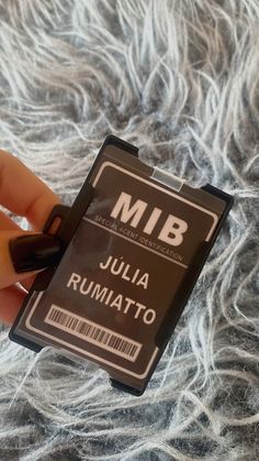 someone is holding a micro sd card in their left hand, which reads mib julia rumatto