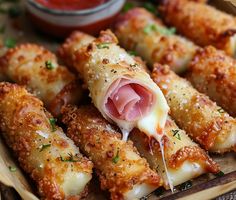 some food is laying on a plate with dipping sauce