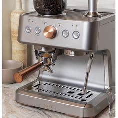 an espresso machine with coffee on the counter