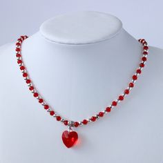 Handmade heart bright red glass bead and silver plated seed bead necklace. This dainty statement necklace is understated gorgeous, something truly lovely you could wear everyday to add a little extra sparkle to your day.  The faceted glass heart catches the light to add that lovely sparkle this necklace will add to any outfit.  Made with  ⭐ 4mm faceted glass rondelle bright red beads ⭐ 4mm silver plated seed beads  ⭐ 14mm faceted bright red heart ⭐ Tibetan silver plated flower patterned pendant Cheap Red Beaded Necklace With Heart Beads, Red Handmade Necklace, Valentine's Day Gift Necklace With Faceted Beads, Red Beaded Necklaces With Heart Beads For Valentine's Day, Red Heart Beads Necklace For Valentine's Day, Red Heart Beaded Necklaces For Valentine's Day, Heart Beaded Necklaces For Valentine's Day Party, Valentine's Day Jewelry With Silver Round Beads, Valentine's Day Jewelry With Silver Beads