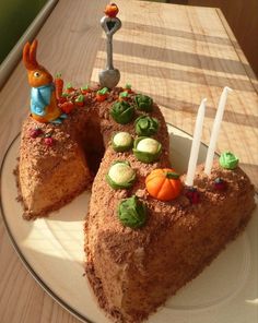 a piece of cake that is on a plate with candles and other decorations around it