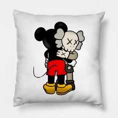 a pillow with a cartoon character hugging it's face