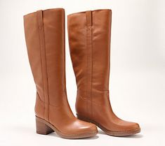 This trend-right tall boot comes to the knee, with a round toe and classic look that exudes luxury. From Marc Fisher LTD. Classic Knee-high Boots With Stacked Heel For Winter, Classic Winter Knee-high Boots With Stacked Heel, Classic Tall Winter Boots, Classic Wide Calf Knee-high Boots For Fall, Classic Almond Toe Knee-high Boots For Fall, Classic Round Toe Knee-high Boots For Fall, Classic Knee-high Boots With Almond Toe For Winter, Elegant Wide Calf Knee-high Boots With Round Toe, Brown Tall Fit Knee-high Boots With Round Toe