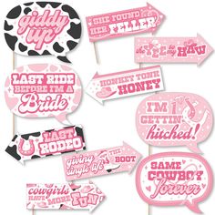 pink and black photo booth props with cowgirl sayings on them for the bachelor party