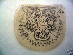 a drawing of a tiger's head on a wall