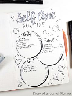 an open notebook with some writing on it and two markers next to it, along with the words self care routine