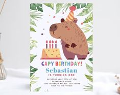 a birthday card with a bear holding a cake on it's head and candles in the background