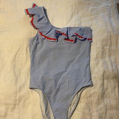 This Is Absolutely The Cutest Swimsuit Ever! J Crew Light Blue And White Seersucker One Shoulder Suit With Adorable Bric-A-Brac Ribbon Detail. Fully Lined With Built-In Shelf Bra. This Suit Has Never Been Worn. Brand New Condition. Just The Wrong Size, So It's Been A Drawer. Perfect For Vacation! Add Some Flowy White Pants Or Skirt And You've Got A Great Look For Dinner Out! Summer Seersucker Swimwear, Spring Striped Bodysuit For The Pool, Spring Seersucker Swimwear For Poolside, Striped One-piece Swimwear For Spring, Spring Striped One-piece Swimwear, Striped Beachwear Bodysuit For Spring, Spring Striped Beachwear Bodysuit, Spring Striped Bodysuit For Beachwear, Spring Beachwear Striped Bodysuit