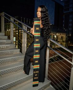 a woman standing on some stairs with a tie