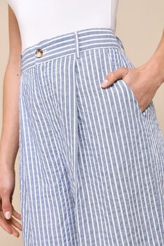 Achieve chic style with minimal effort, thanks to the Lulus Breezy Direction Blue and White Striped High-Rise Wide Leg Pants! Lightweight, cotton-blend woven fabric, with a summery striped pattern throughout, shapes a high-rise silhouette with belt loops, front diagonal pockets, and a hidden zip fly with a top button closure. Wide legs fall to ankle-length hems. Decorative welt pockets at back. Fit: This garment fits true to size. Length: Floor length. Size medium Inseam: 31.75 Front Rise: 12.00 Chic Blue Cotton Wide Leg Pants, Chic Blue Linen Bottoms, Chic Blue Linen Pants, Blue High-waisted Wide Leg Cotton Pants, Spring Wide-leg Pants With Vertical Stripes, Blue Mid-rise Wide Leg Cotton Pants, Spring Striped Wide-leg Pants, Blue High-waisted Pants With Vertical Stripes, Resort Wear Beach