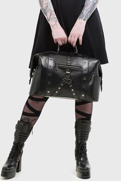 INFUSION.- Smooth, shiny PU.- Inner pockets.- Multiple outer pockets.- Side snap poppers.- PU handle.- Detachable shoulder strap.- Gunmetal hardware details.- Zip closure.- Lined.- Width 39.5cm / 15.6".- Height 25cm / 9.8".- Depth 18cm / 7.1".- Shoulder strap 77cm - 97cm / 30"- 38".With KILLSTAR branding, Main Fabric: 100% Polyurethane, Lining: 100% Polyester.Do not wash / Do not bleach / Do not tumble dry / Do not iron / Do not dry clean. Imported. Black Gothic Bag With Hardware, Edgy Black Bag With Hardware Details, Edgy Black Bag With Hardware, Edgy Black Bags With Hardware, Black Alternative Style Bags With Hardware, Punk Bags With Hardware For Alternative Fashion, Punk Rectangular Bag With Adjustable Strap, Punk Style Bags With Hardware For Daily Use, Gothic Black Bags With Metal Hardware